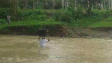 Teacher crosses dangerous rivers to bring modules to students in remote areas