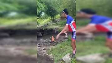 Masskara cyclist na pinainom ng maruming tubig mula sa sapang may kalabaw, umalma