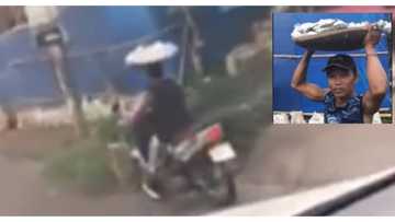 Video ng fish vendor na nagmomotor habang may paninda sa ulo, umabot na sa 1 million views