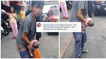 Woman unexpectedly gives birth standing up in busy street