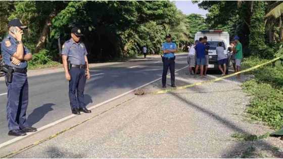 Tied dead body of a man covered by banana leaf found on the roadside in Sariaya, Quezon