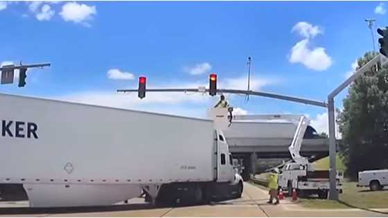 Electrical worker hangs upside-down while at work after being hit by an 18-wheeler truck