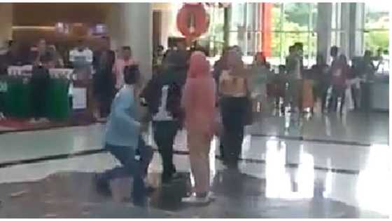 Furious wife attacks husband caught proposing to alleged girlfriend