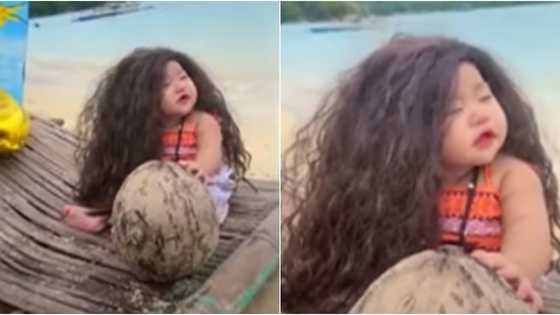 8-month-old na baby girl, cute na cute habang nilalabanan ang antok sa gitna ng kayang photoshoot