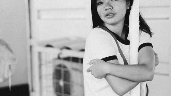 After my mom died, I found an album – In 1 photo, a girl stood beside me, looking exactly like me