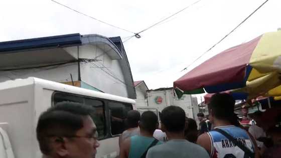 Bizarre standoff ends in lucky plunge as man jumps from roof into Dagupan river