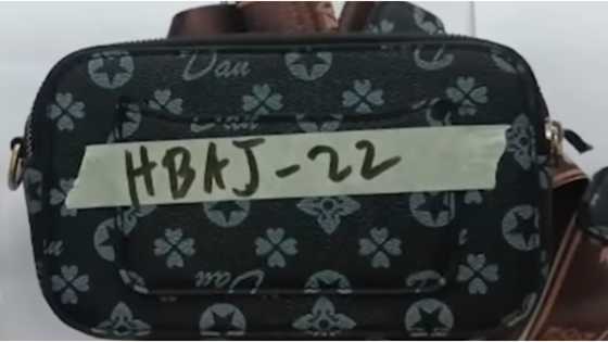 Babaeng umo-order sa fastfood, hinablutan ng bag; sekyu, aksidenteng napagbuksan ng pinto ang suspek