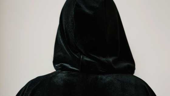 At my wedding, an elderly woman in a black robe appeared & pointed at my groom