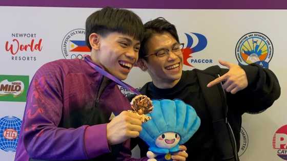 Carlos Yulo reacts to Karl Eldrew Yulo winning two bronze medals at Junior World Championships