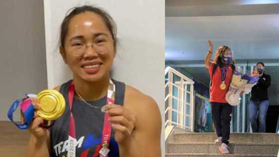 Olympic gold medalist Hidilyn Diaz now back in the Philippines; photos of her arrival go viral