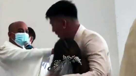 Nakakatuwang video ng pagpapatigil ng pari sa "kiss the bride" moment, viral