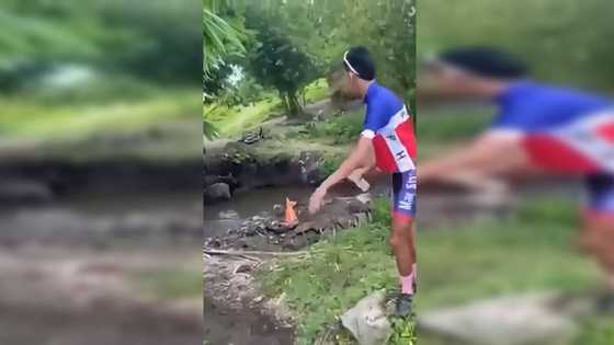 Masskara cyclist na pinainom ng maruming tubig mula sa sapang may kalabaw, umalma