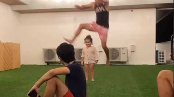 Derek Ramsay leaps over Ellen Adarna's son in a game of luksong baka